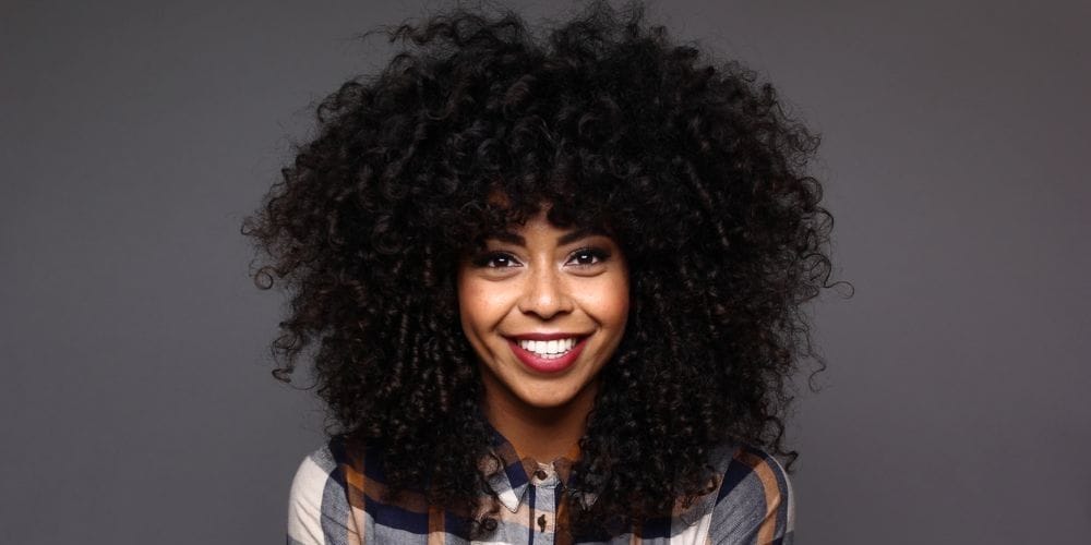 Black woman with beautiful natural hair style.