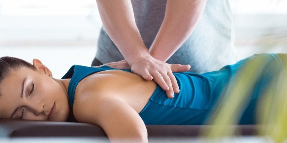 Chiropractor making an adjustment.
