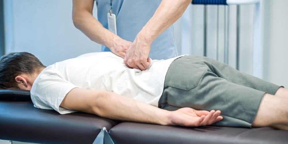 Chiropractor giving a patient an adjustment.