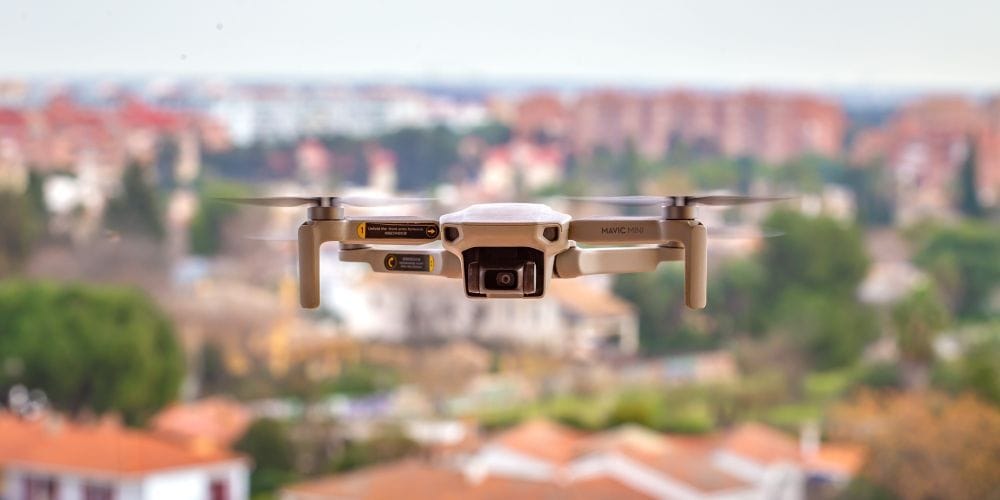 Aerial drone taking photos of residential properties.