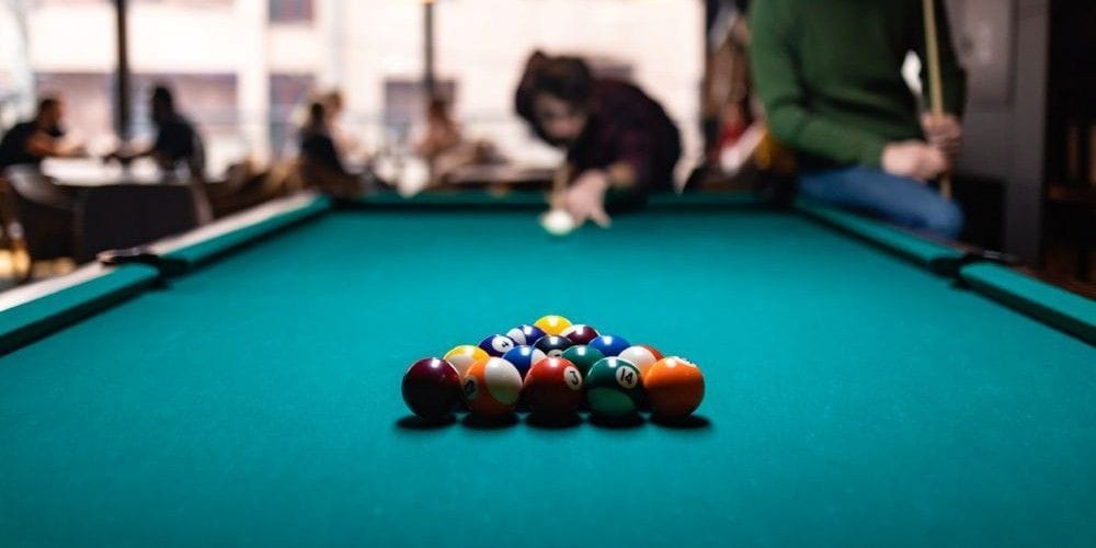 Billiard table at a sports bar.