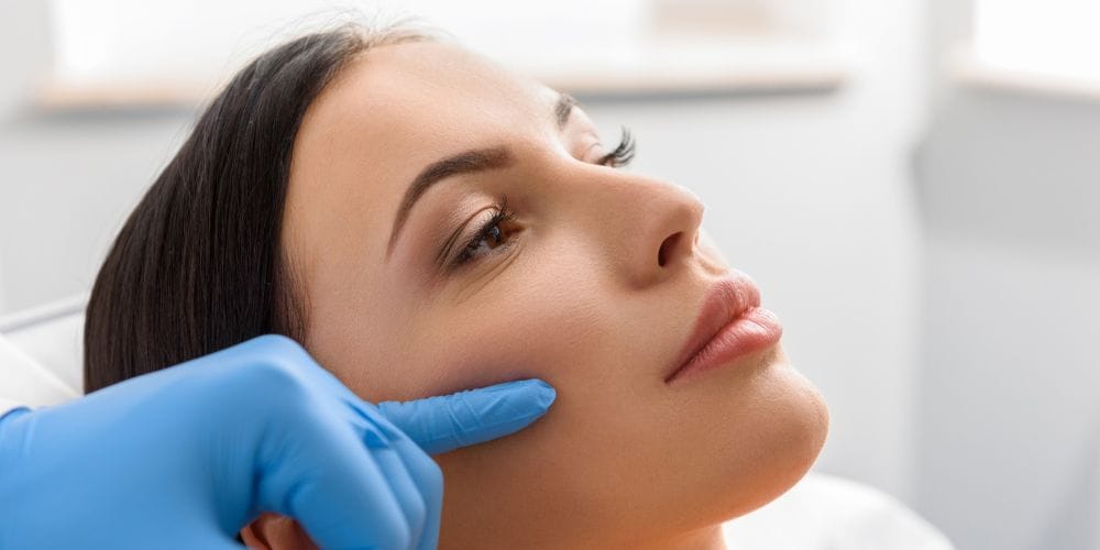 A woman getting an aesthetic treatment at a medical spa.