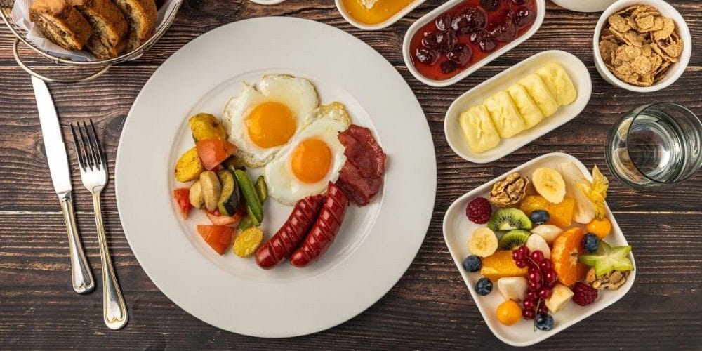 Traditional English breakfast served at the table.