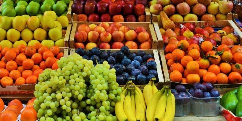 Local country grocery market display of a variety of fruits and vegetables.
