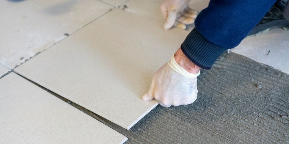 Tile Contractor installing a new tile floor.