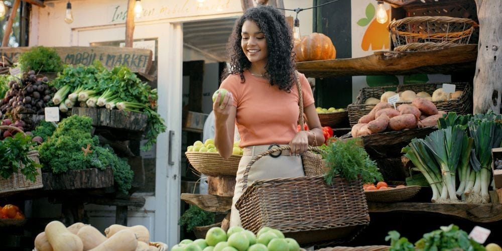 Woman shopping at a farmers market.