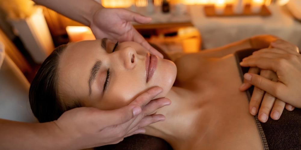 Woman receiving a face massage.